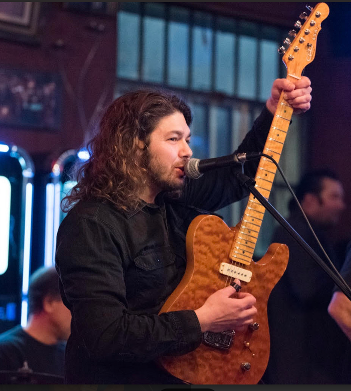 Singer Chris Monti with his guitar