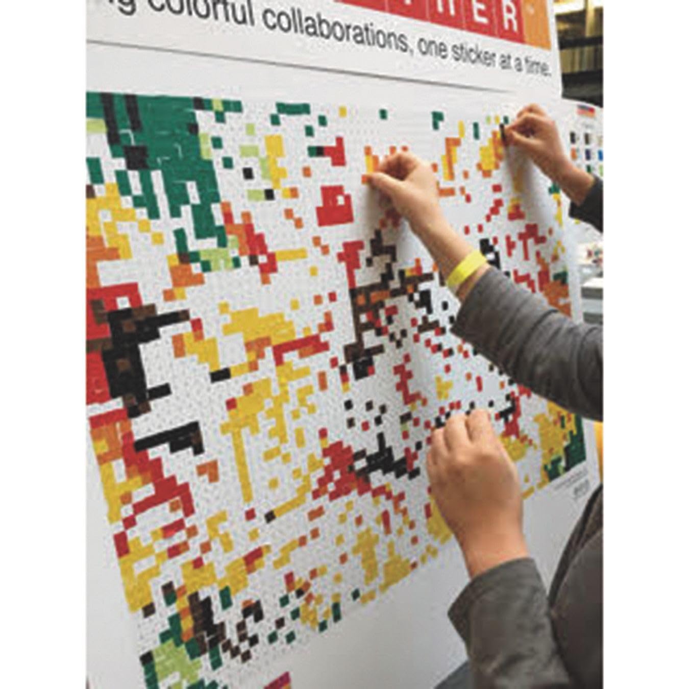 putting stickers on poster