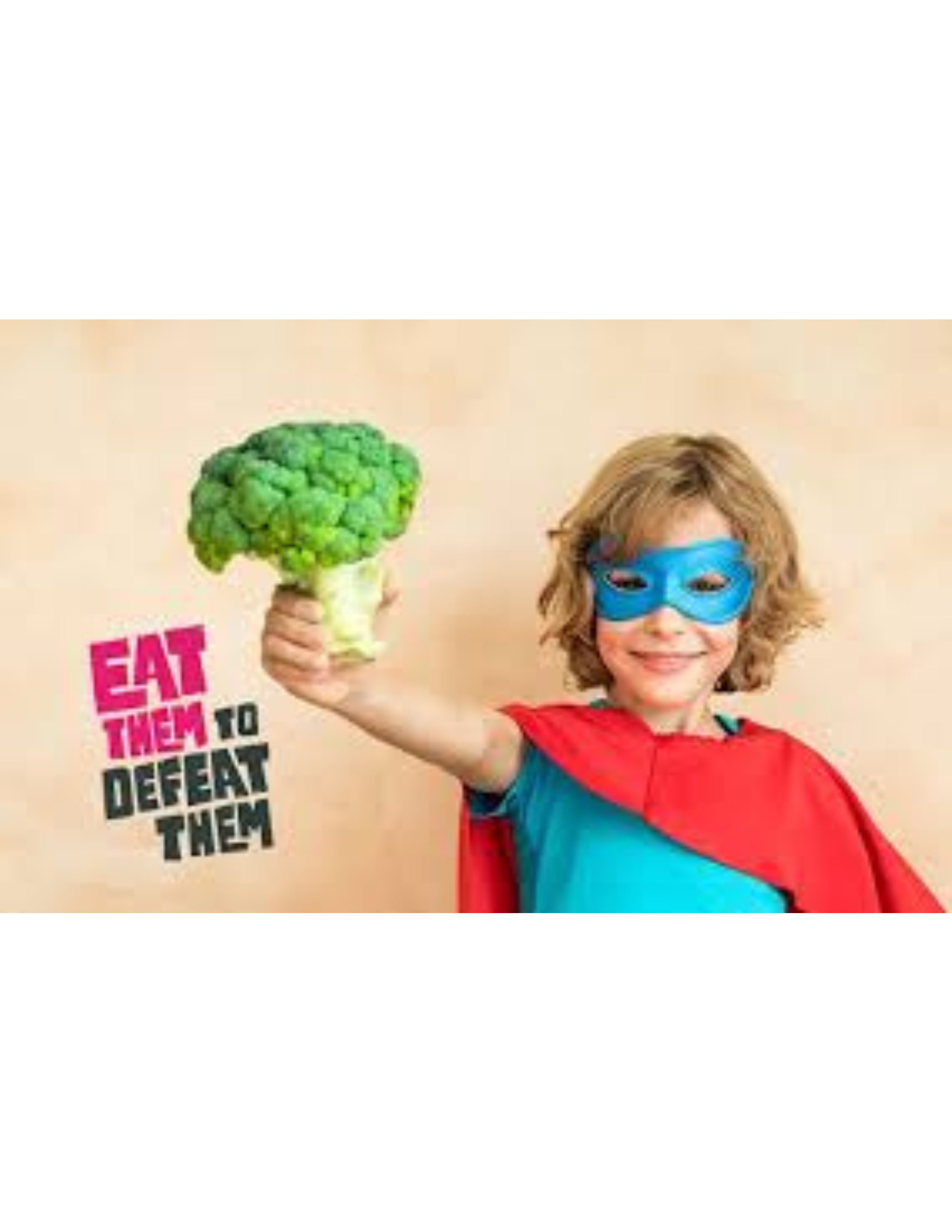 Child with superhero mask holding broccoli