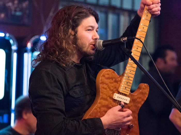 Singer Chris Monti with his guitar