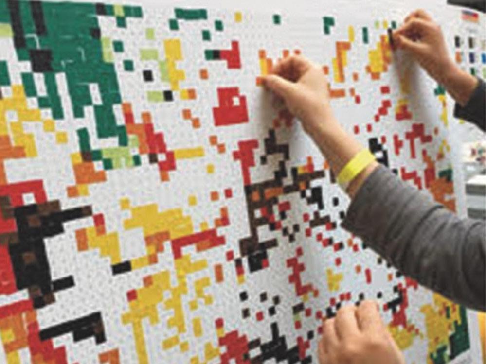 putting stickers on poster